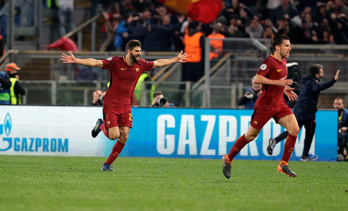 Roma’s Federico Fazio, left, celebrates with teammates after Kostas Manolas scored his side’s 3rd goal, during the Champions League quarterfinal second leg soccer match between Roma and FC Barcelona at Rome’s Olympic Stadium, Tuesday, April 10, 2018. 