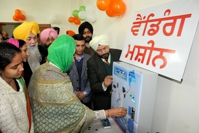 Amritsar: Girls purchase sanitary napkins from a Sanitary Napkin Vending Machines installed at Village Chogawan located on the outskirts of Amritsar, on Jan 29, 2016. (Photo: IANS)