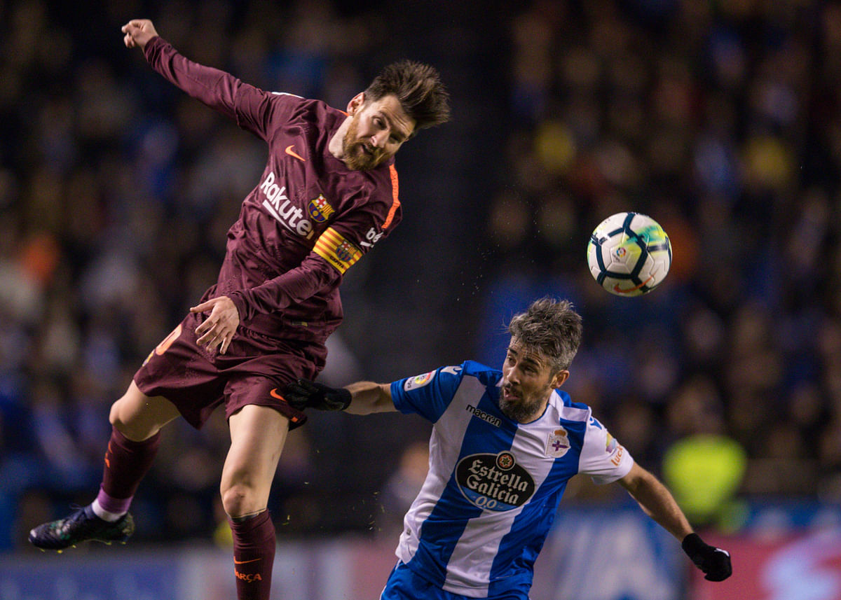 Lionel Messi scored a hat-trick as Barcelona clinched a 25th Liga title after winning 4-2 at Deportivo La Coruna.