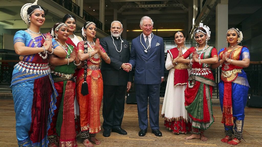 Prime Minister Narendra Modi and Prince Charles pose with dancers during a visit the Science Museum in London