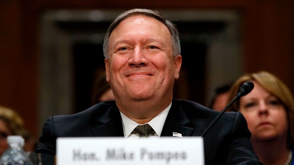 Newly appointed Secretary of State Mike Pompeo smiles after his introduction before the Senate Foreign Relations Committee.