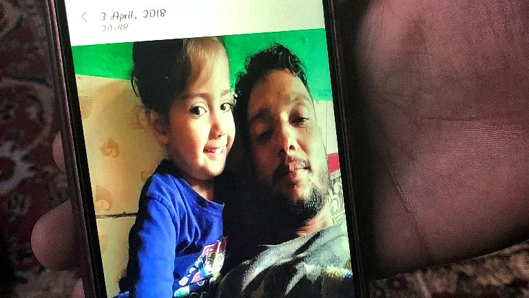 A picture of Naseer Ahmad along with his eldest daughter. 