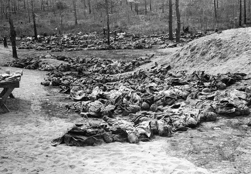 The Katyn Massacre, 1940: Rows of exhumed bodies of Polish officers placed on the ground by the mass graves, awaiting examination. <i>Date: 30 April 1943 </i><i>(World War II)</i>