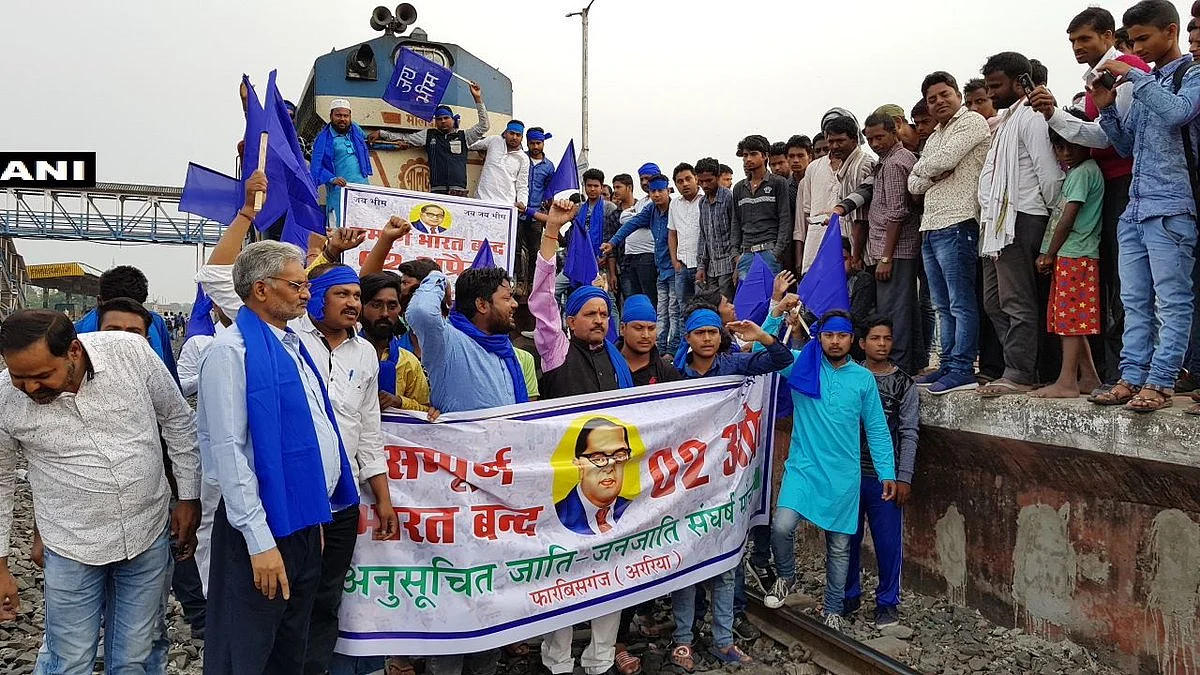 Protesters block a train in Bihar’s Arrah.