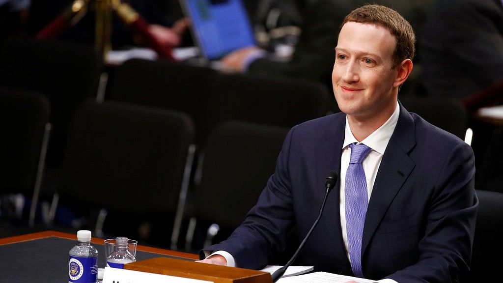 Facebook CEO Mark Zuckerberg smiles as he testifies before a joint hearing of the Commerce and Judiciary Committees on Capitol Hill in Washington.