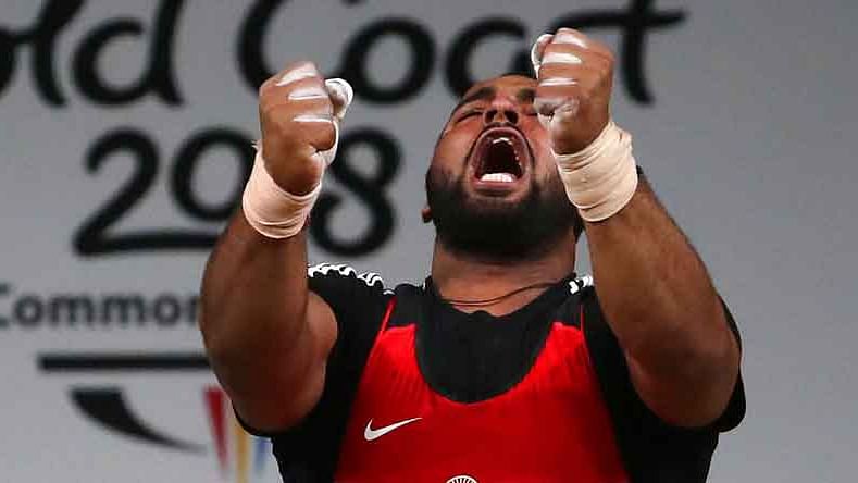 Pardeep Singh celebrates after a lift at the Commonwealth Games 2018.