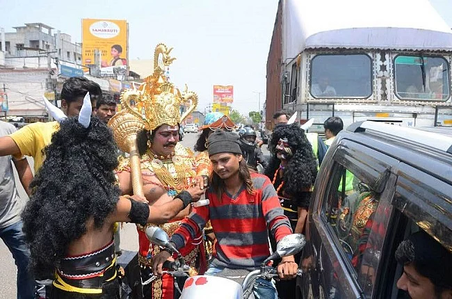 Actors round-up a traffic rules violator