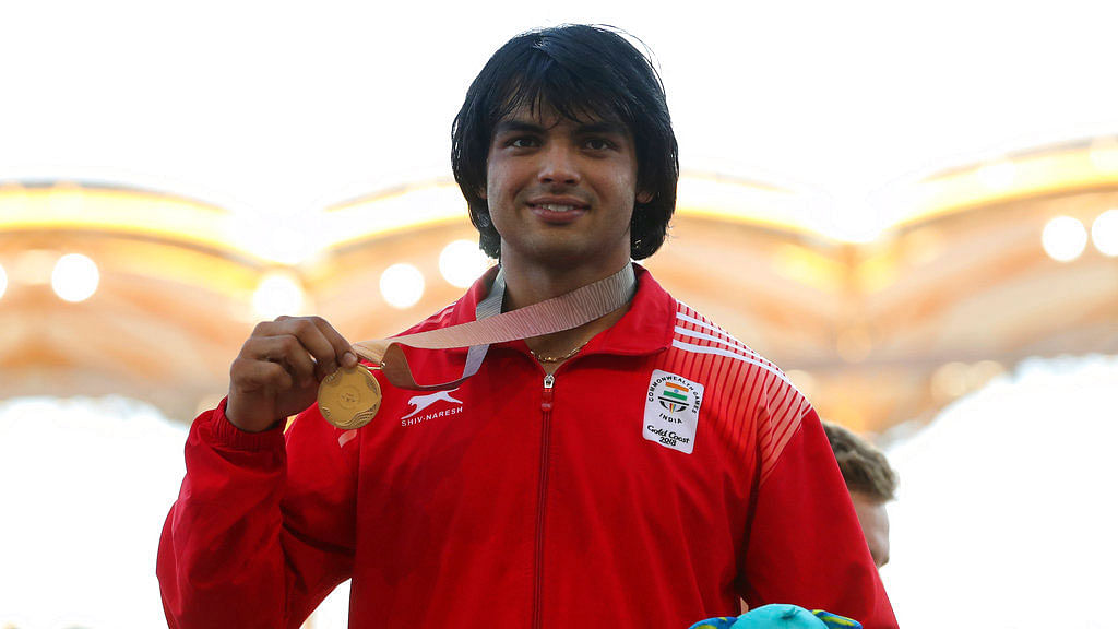 Neeraj Chopra poses with his gold medal at the 2018 Commonwealth Games.