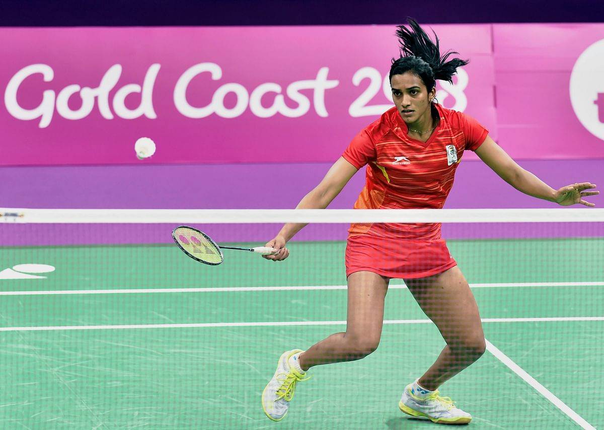 Saina Nehwal and P V Sindhu sailed into the semifinals of the women’s singles competition at the Commonwealth Games.