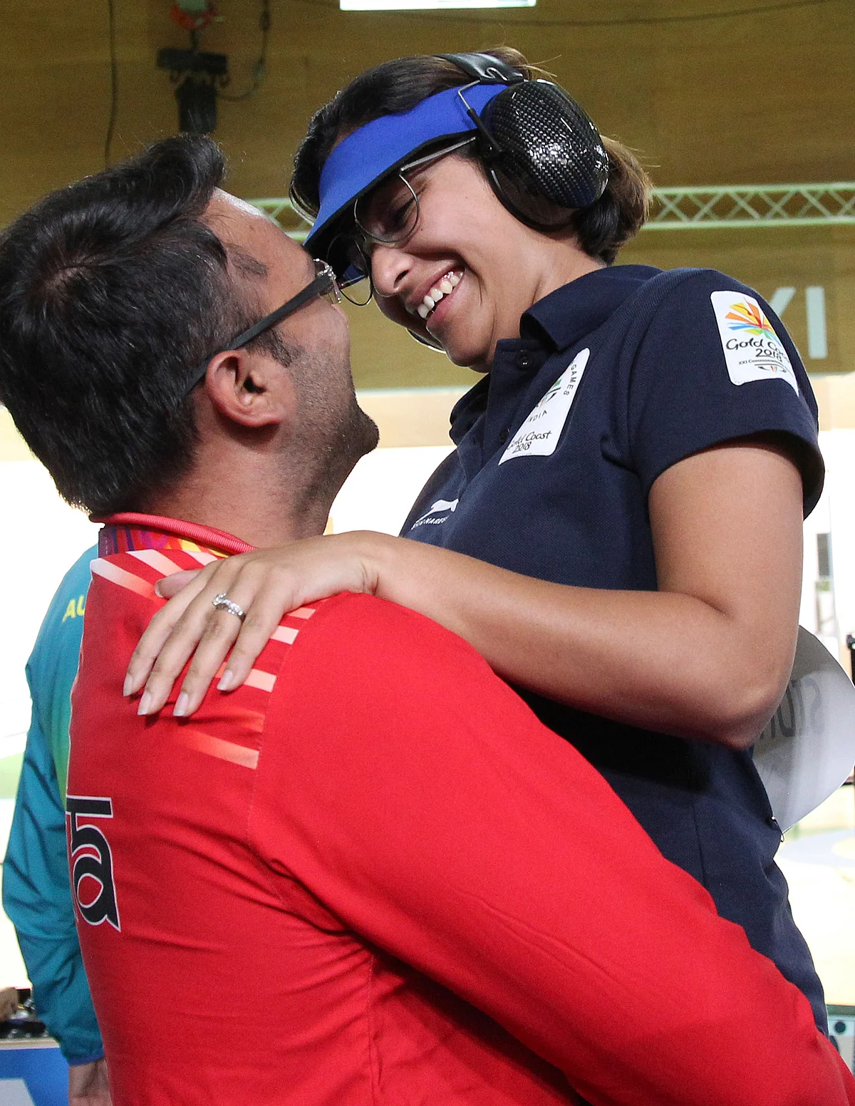 Heena Sidhu, right, celebrates with her husband and coach Ronak Pandit, left, after winning the gold medal during the women’s 25m Pistol final at the Belmont Shooting Centre during the 2018 Commonwealth Games in Brisbane