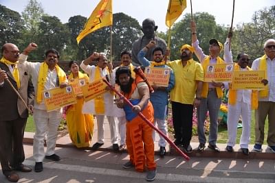 New Delhi: TDP MPs stage a demonstration to press for special status for Andhra Pradesh at Parliament in New Delhi. (Photo: IANS)