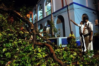 Kolkata: A tree uprooted at Jorabagan Police Station during rain and storm that hit Kolkata on April 17, 2018. (Photo: IANS)