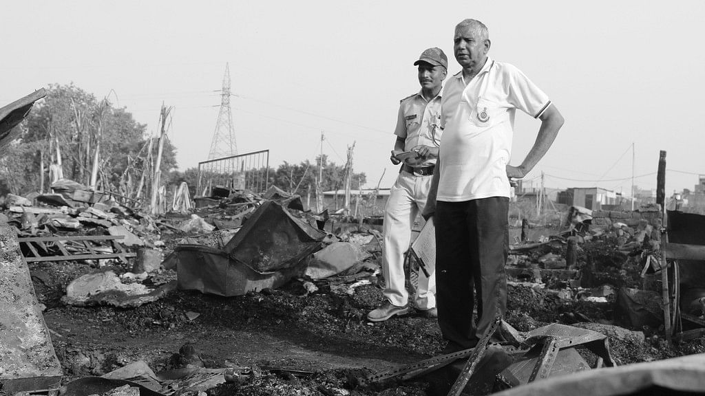 Delhi Police officials at the site of the fire.