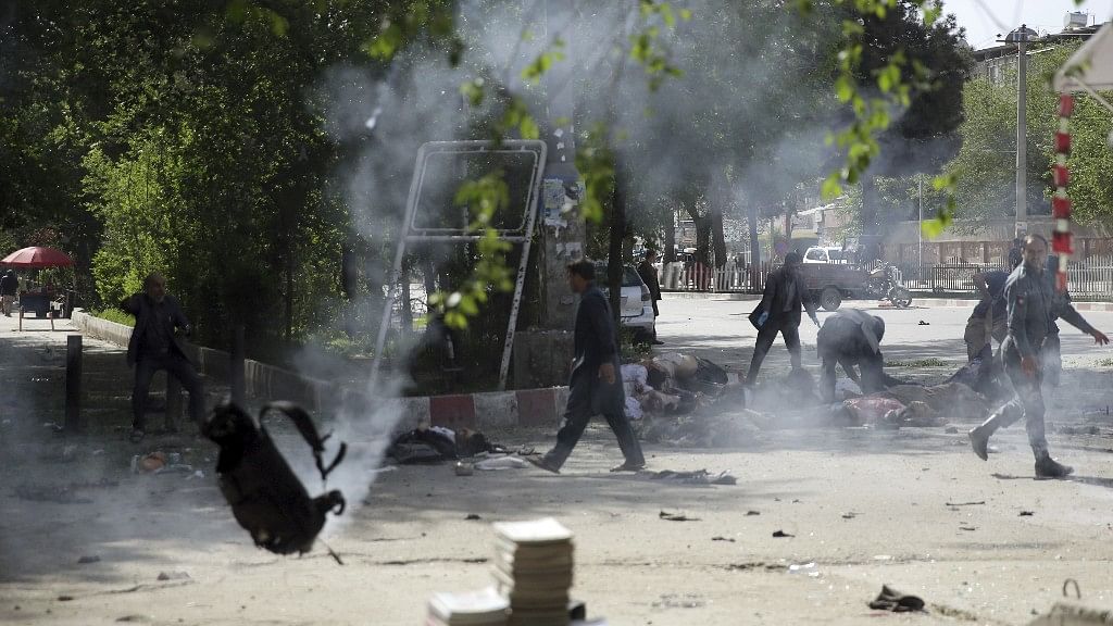 Two blasts hit the Afghan capital Kabul on Monday, killing at least 25 people, including a photographer for French news agency AFP.