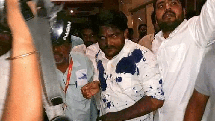 An ink-stained Hardik Patel leaves the Ujjain hotel.
