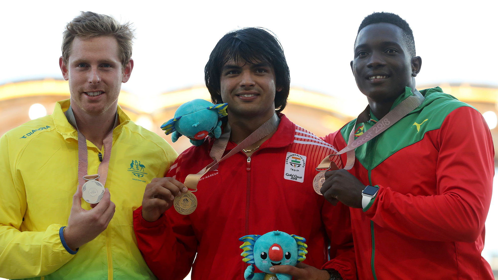 Men’s javelin gold medalist India’s Neeraj Chopra, centre, stands next to silver medalist Australia’s Hamish Peacock, left, and bronze medalist Grenada’s Anderson Peters.