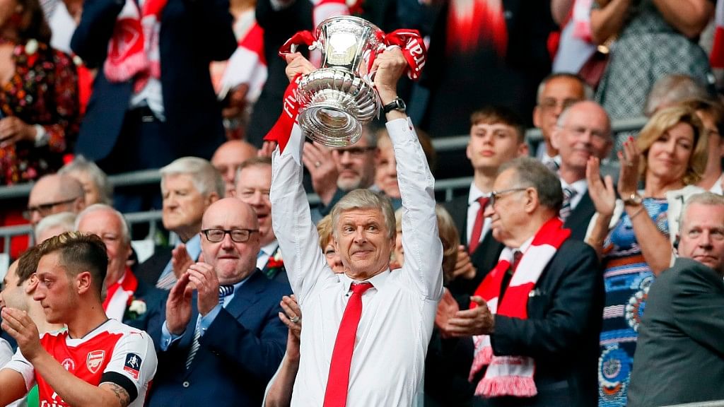 File picture of Arsenal team manager Arsene Wenger celebrating with the trophy after winning the English FA Cup final soccer match between Arsenal and Chelsea at Wembley stadium in 2017