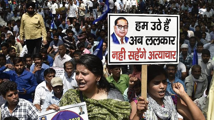 Members of the Dalit community raise slogans during the Bharat Bandh against the alleged dilution of SC/ST Act in New Delhi, on 2 April 2018.
