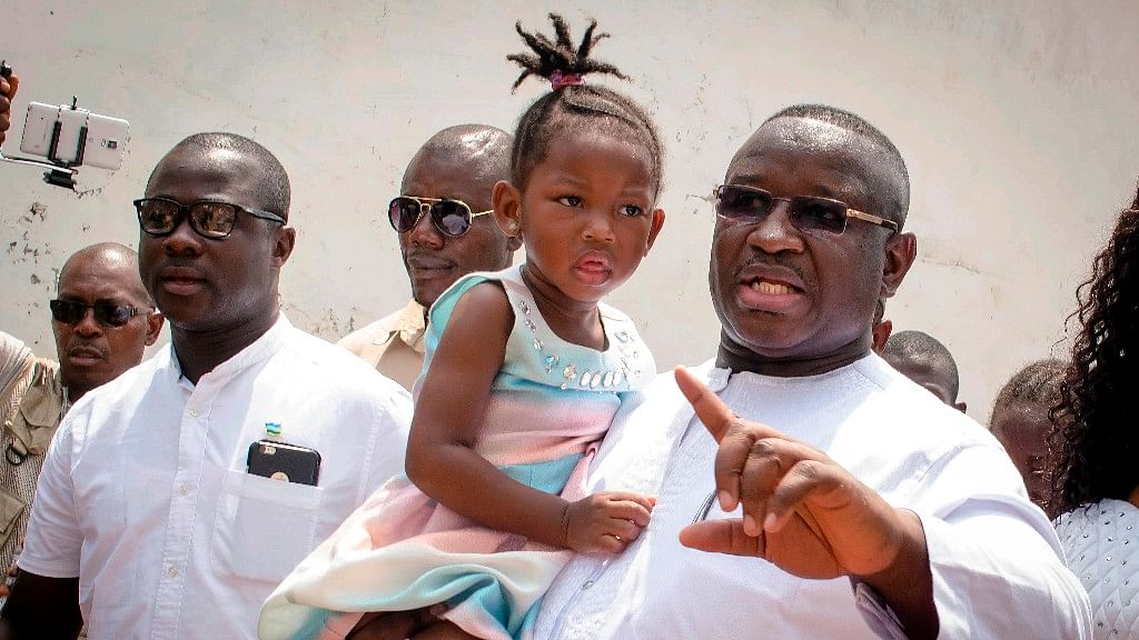 File photo, Julius Maada Bio, right, presidential candidate for the main opposition Sierra Leone People’s Party.