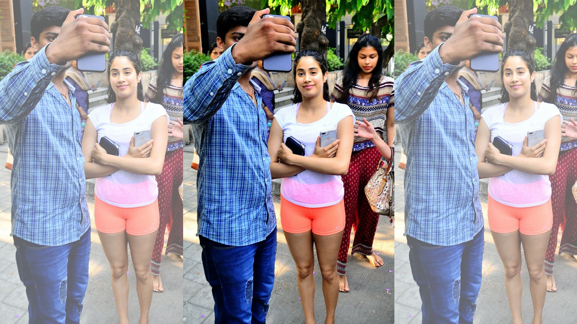 Janhvi poses for a selfie with a fan.