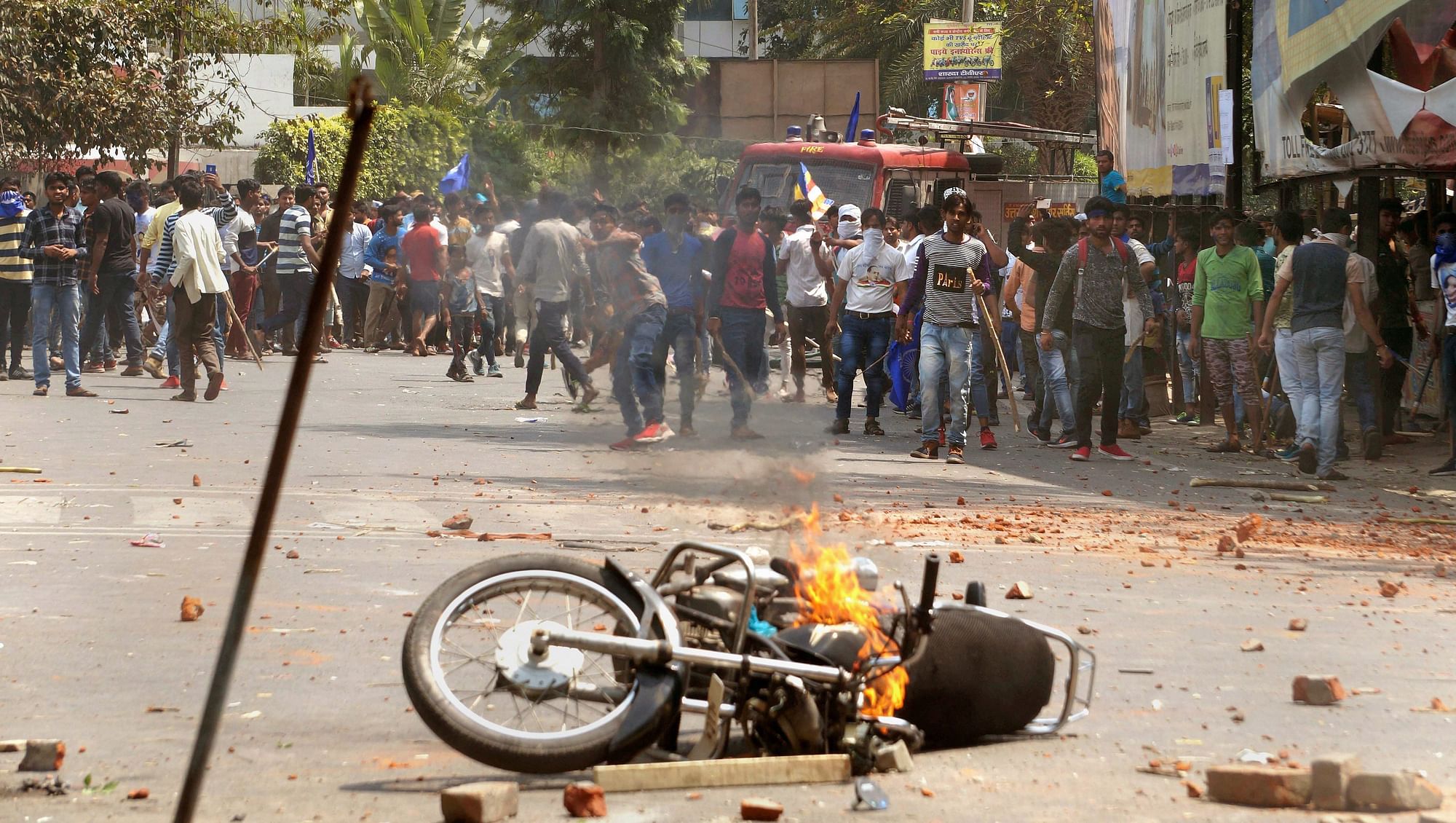 A burned motorcycle in Meerut, UP, a result of Bharat Bandh protests turned violent in the state.