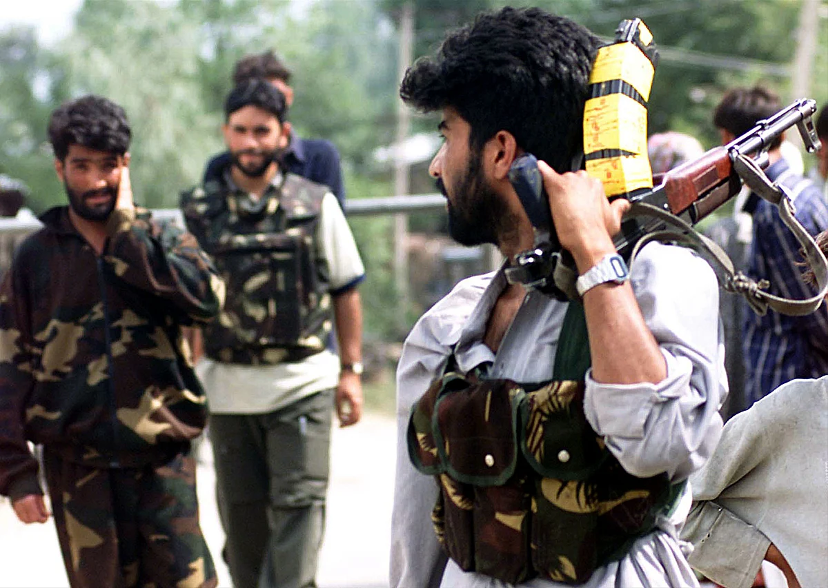 Members of Ikhwan patrol near their camp at Aishmuqam 80 kms south of Srinagar, July 17, 2002.