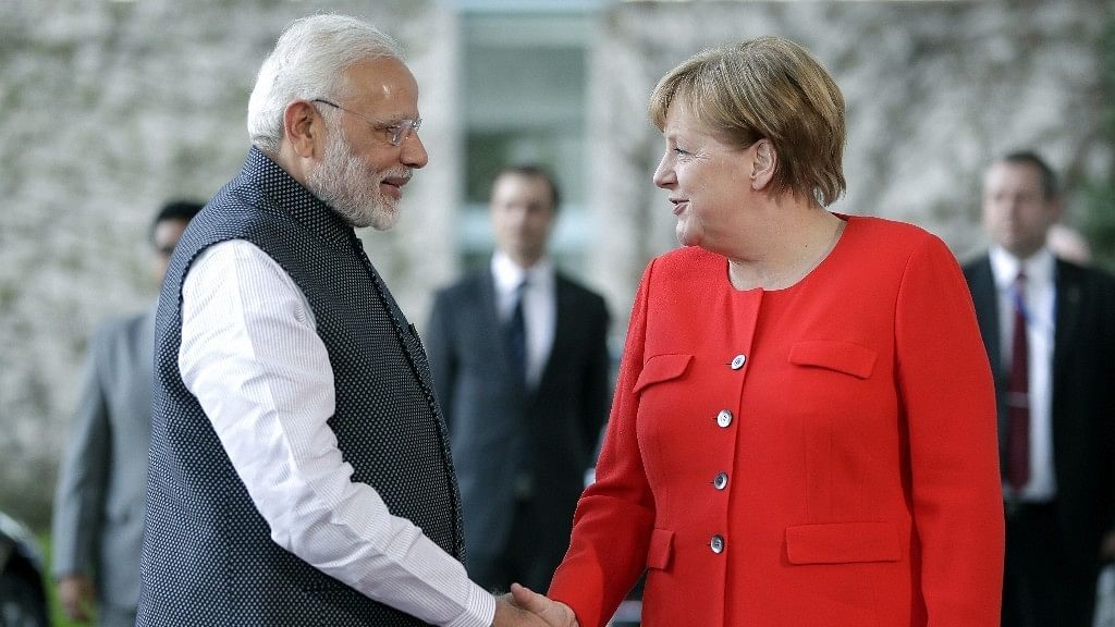 Prime Minister Narendra Modi with German Chancellor Angela Merkel in Berlin.&nbsp;