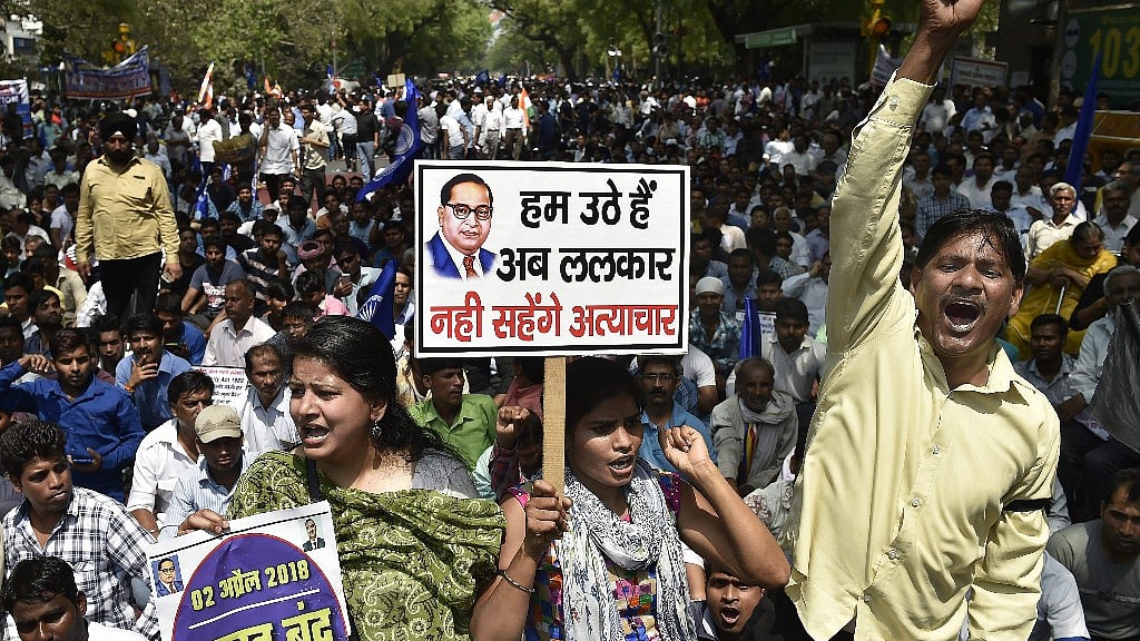 Members of the Dalit community raise slogans during Bharat Bandh against the alleged dilution of SC/ST Act in New Delhi, on 2 April 2018.