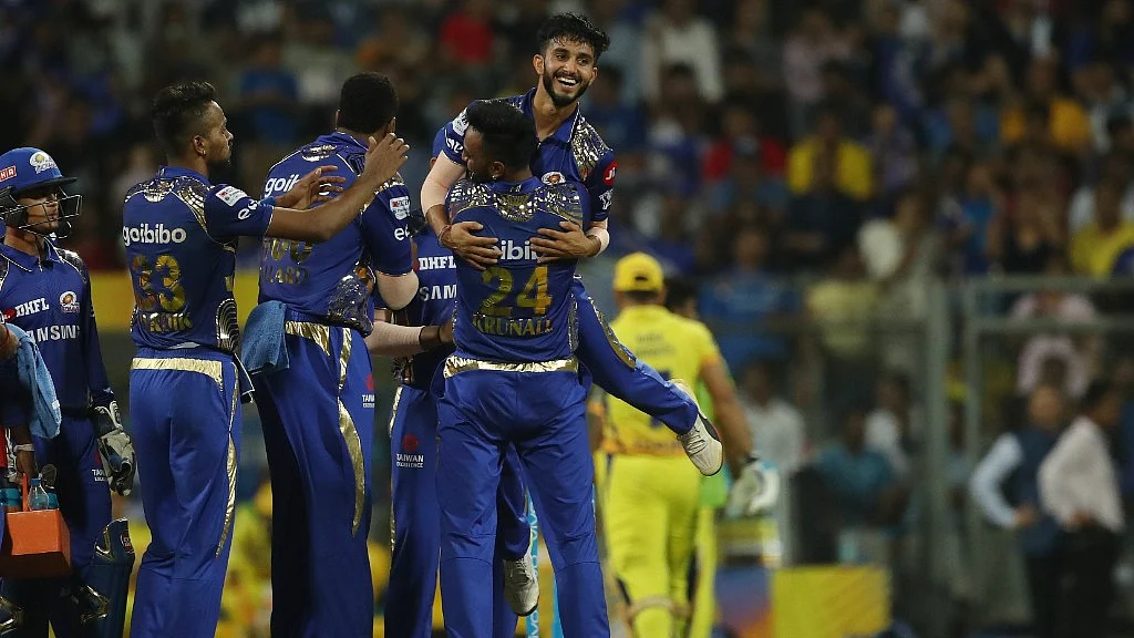 Mayank Markande celebrates with his Mumbai Indians’ teammates after dismissing Mahendra Singh Dhoni in the first match of IPL 2018 on 7 April in Mumbai. 