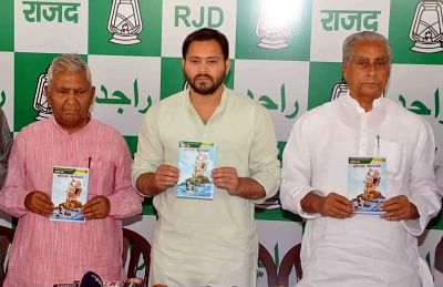 Patna: RJD leaders Tejashwi Yadav and Jagada Nand Singh release "Arop Patra" - a compilation of charges against the Nitish Kumar government, in Patna on April 4, 2018. (Photo: IANS)