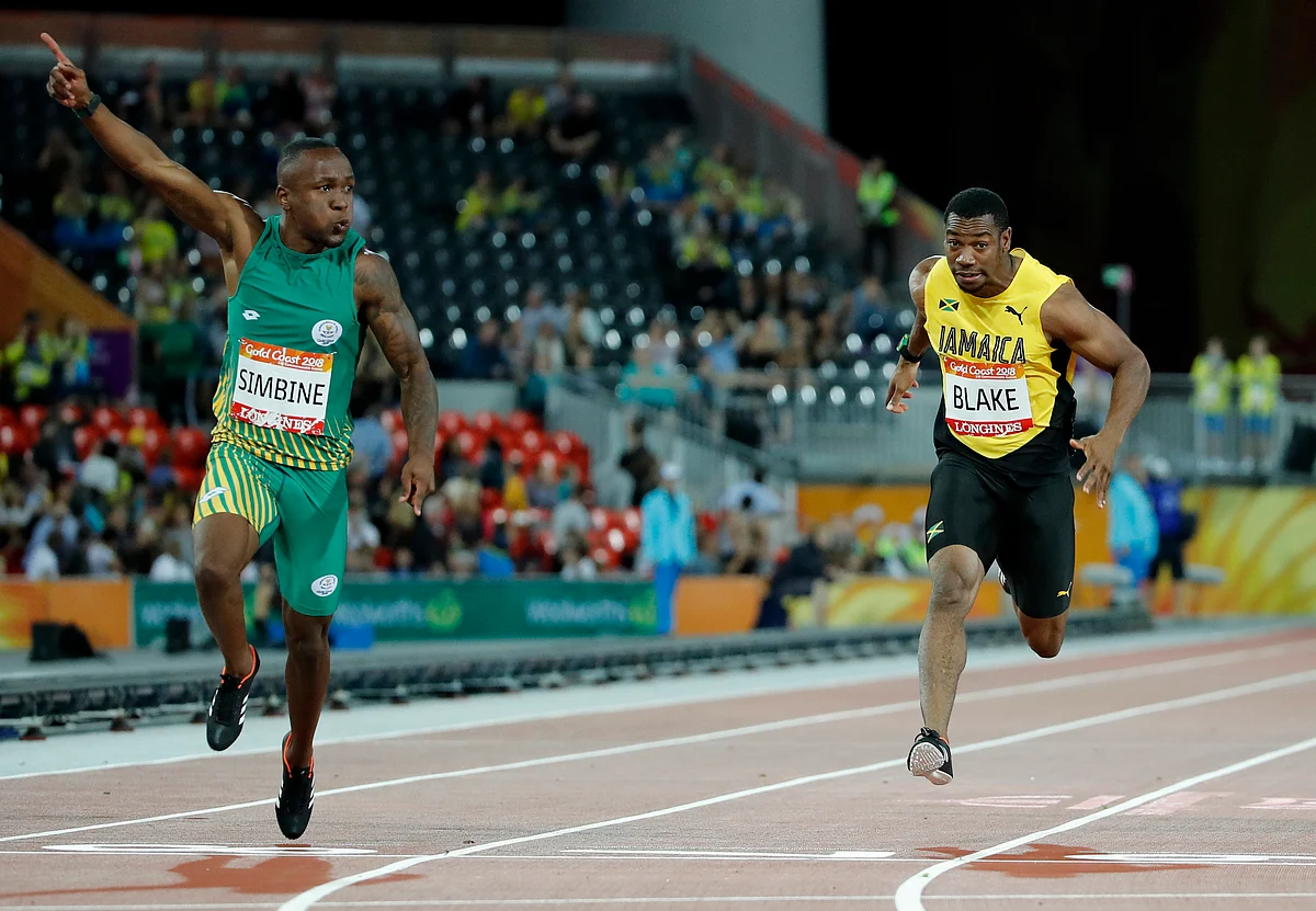 South Africa’s Akani Simbine, left, celebrates after winning the men’s 100m final at Carrara Stadium during the 2018 Commonwealth Games on the Gold Coast, Australia, Monday, April 9, 2018. Jamaica’s Yohan Blake, right, finished third.