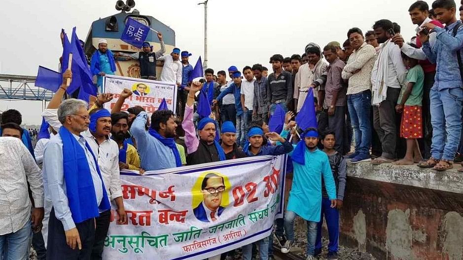 Dalit protesters blocked trains, clashed with police and set fire to vehicles in violent protests across seven states. 