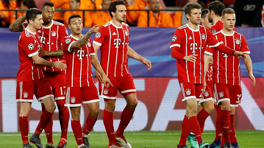Bayern Munich’s players celebrate with teammates after scoring his side’s second goal during the first leg Champions League quarterfinal match against Sevilla FC at the Sanchez Pizjuan stadium in Seville last week. 
