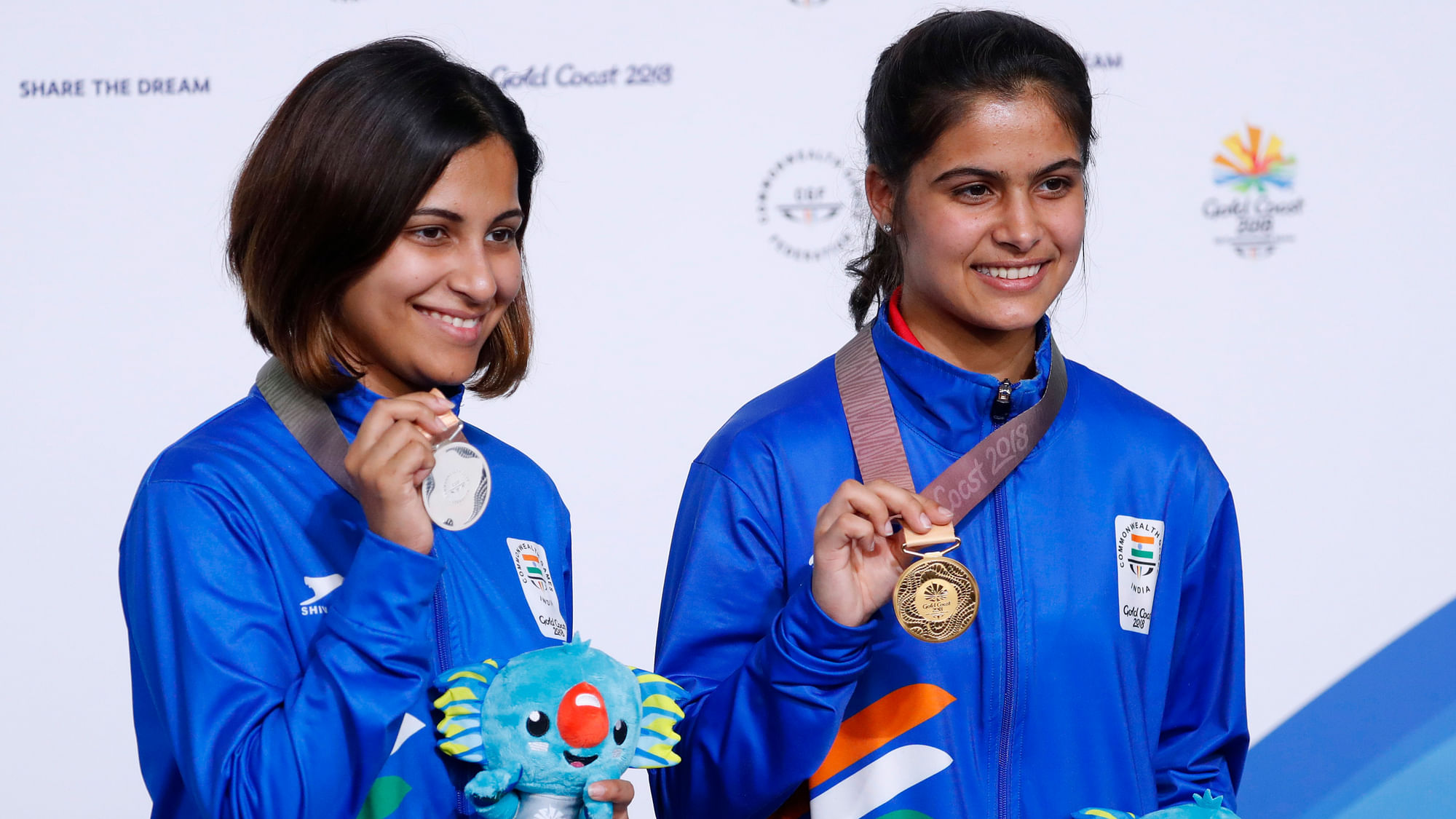 CWG Gold medallist Manu Bhaker and Silver medallist Heena Sidhu of India pose with their medals and Borobi plush dolls.&nbsp;