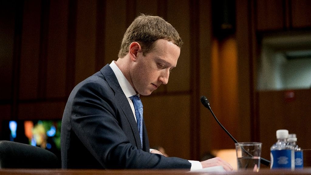 Facebook CEO Mark Zuckerberg pauses while testifying before a joint hearing of the Commerce and Judiciary Committees on Capitol Hill in Washington.