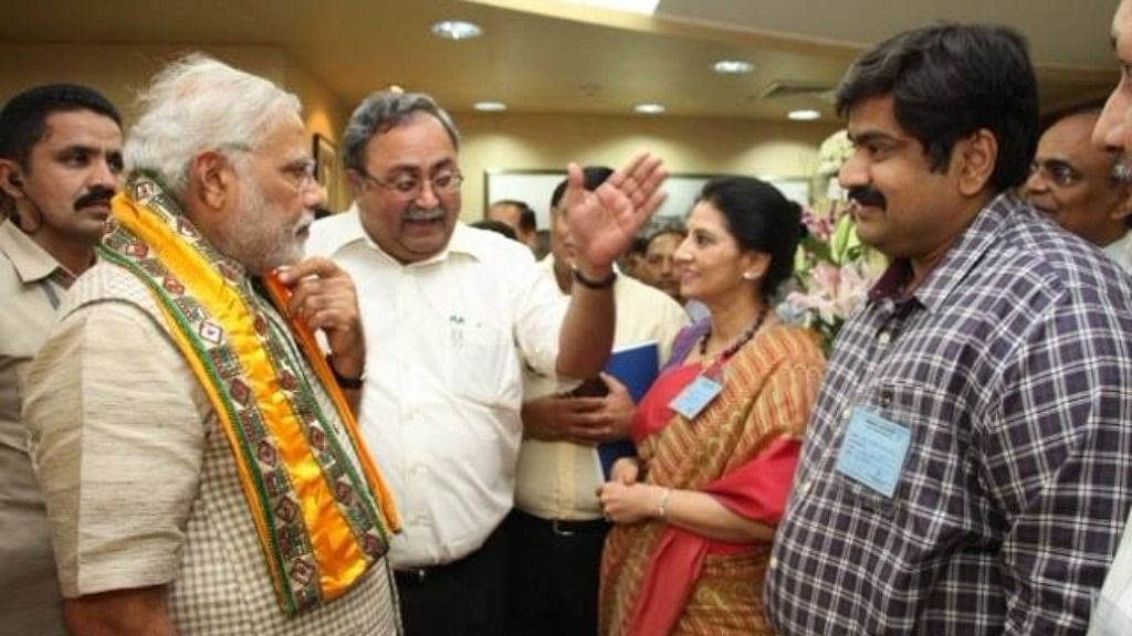 Amit Bhatnagar (right) with PM Narendra Modi (left) and BJP leader Saurabh Patel (centre).