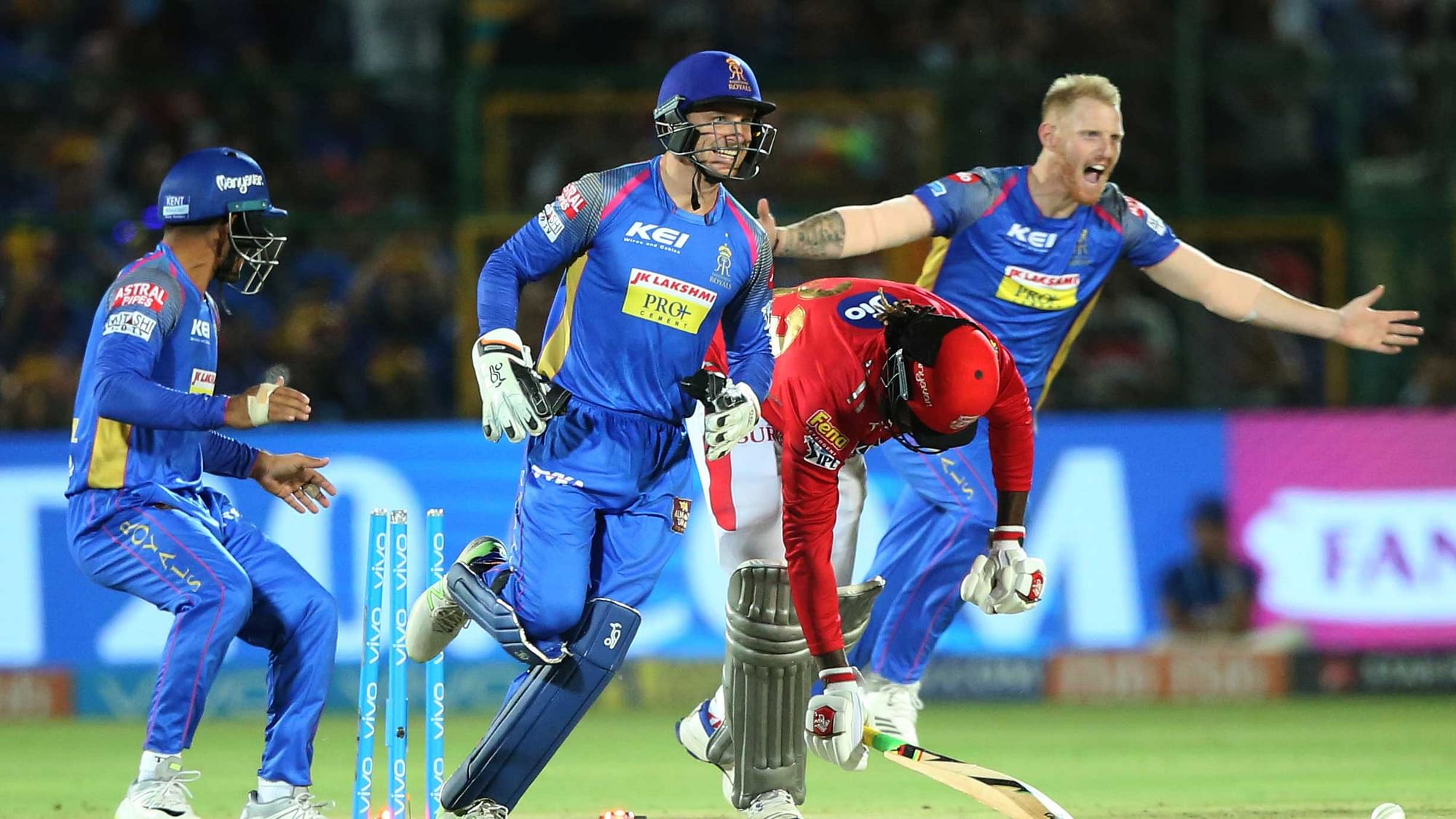 Rajasthan Royals players celebrate the wicket of Chris Gayle in the third over of the Kings XI Punjab chase.