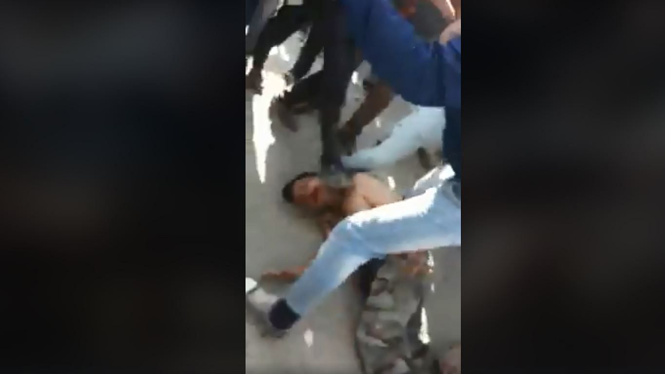 Visuals from the video where the soldier is being beaten up by the mob.