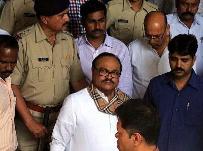 Mumbai: NCP leader Chhagan Bhujbal who was arrested by the Enforcement Directorate in connection with corruption cases lodged against him being taken to be produced at a Mumbai court, on March 15, 2016. (Photo: IANS)