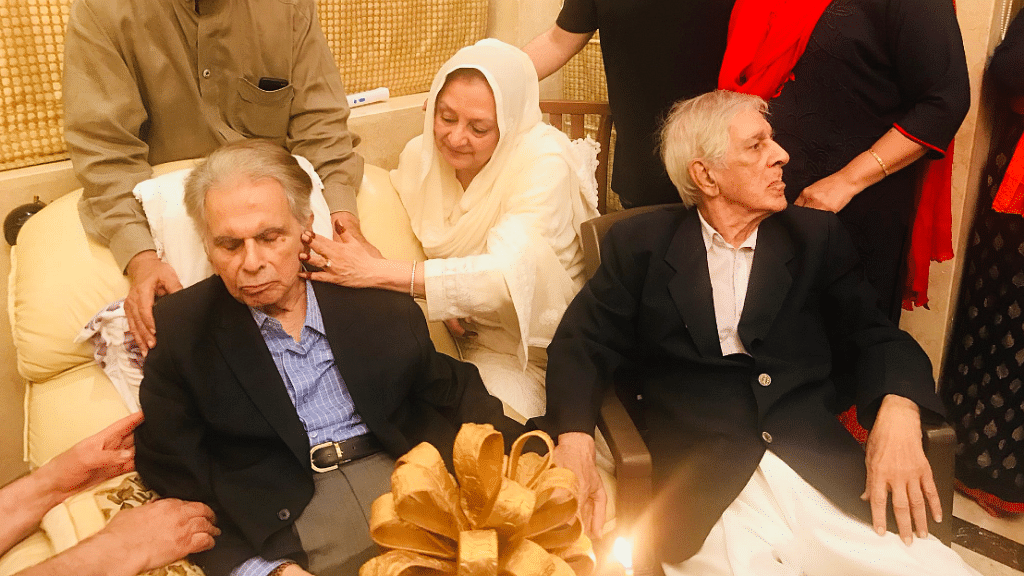 Dilip Kumar with Saira Banu with a guest at their home.