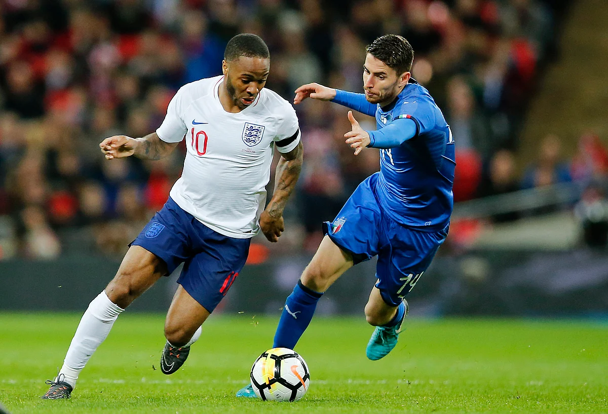 In this Tuesday, March 27, 2018 filer, England’s Raheem Sterling, left, and Italy’s Jorginho vie for the ball during the international friendly soccer match between England and Italy at the Wembley Stadium in London. 