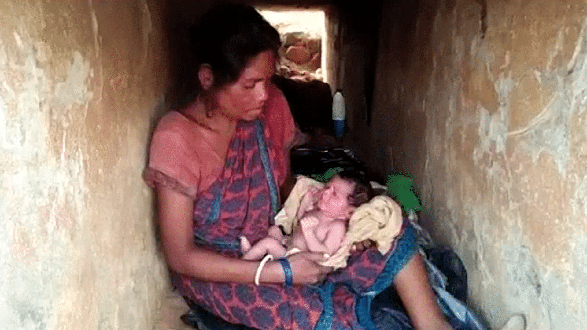 A woman gives birth in a culvert in Mayurbhanj district of Odisha