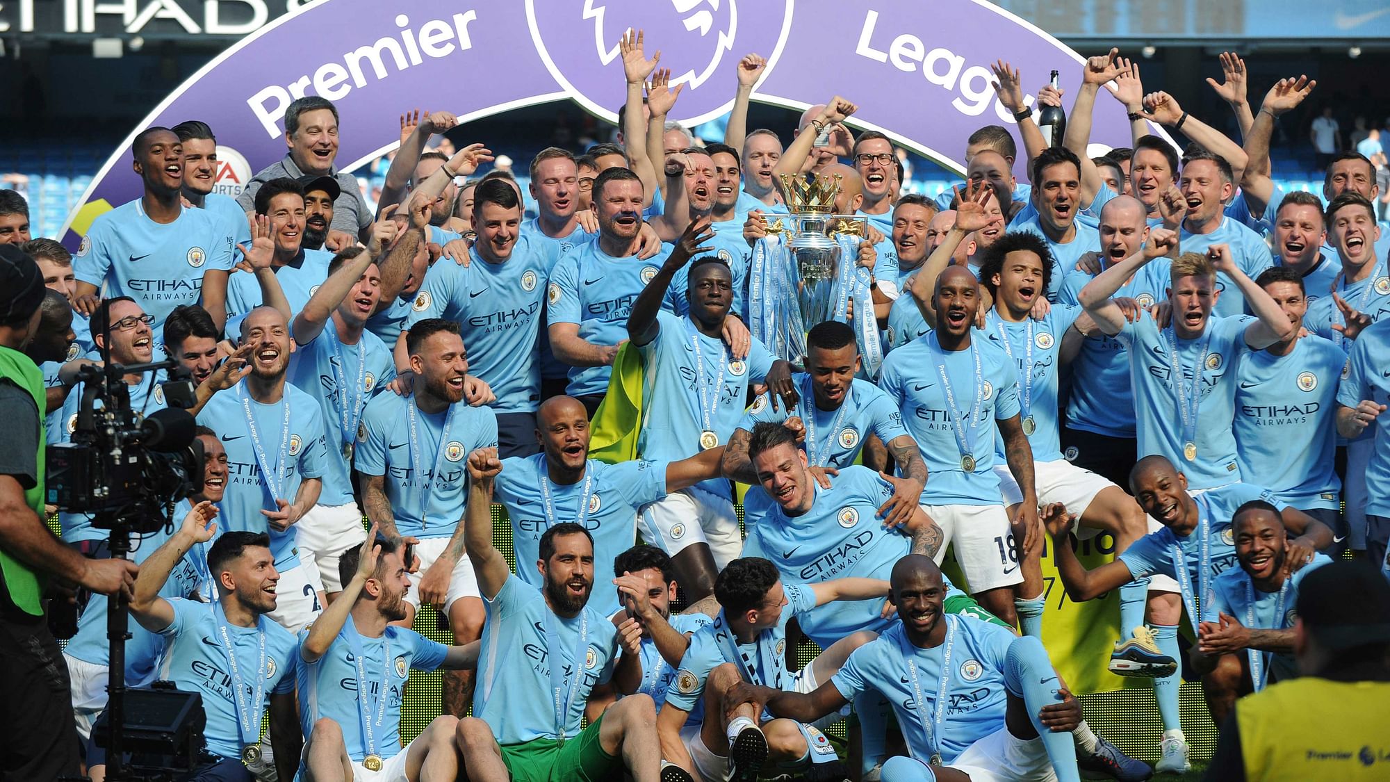 Manchester City players lift the English Premier League trophy after the soccer match between Manchester City and Huddersfield Town at Etihad stadium in Manchester, England, Sunday, May 6, 2018.