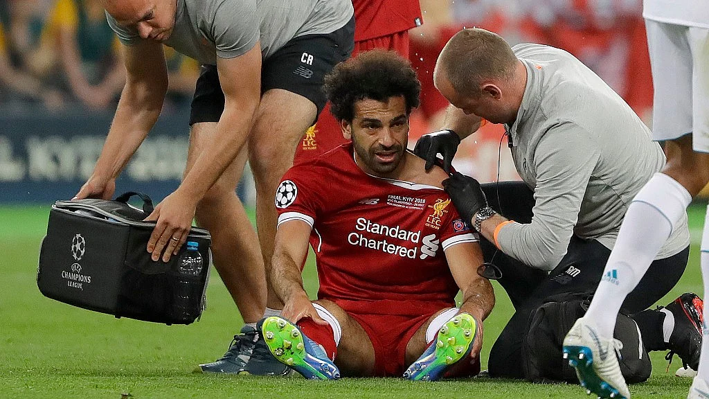 Liverpool’s Mohamed Salah gets medical treatment during the Champions League Final