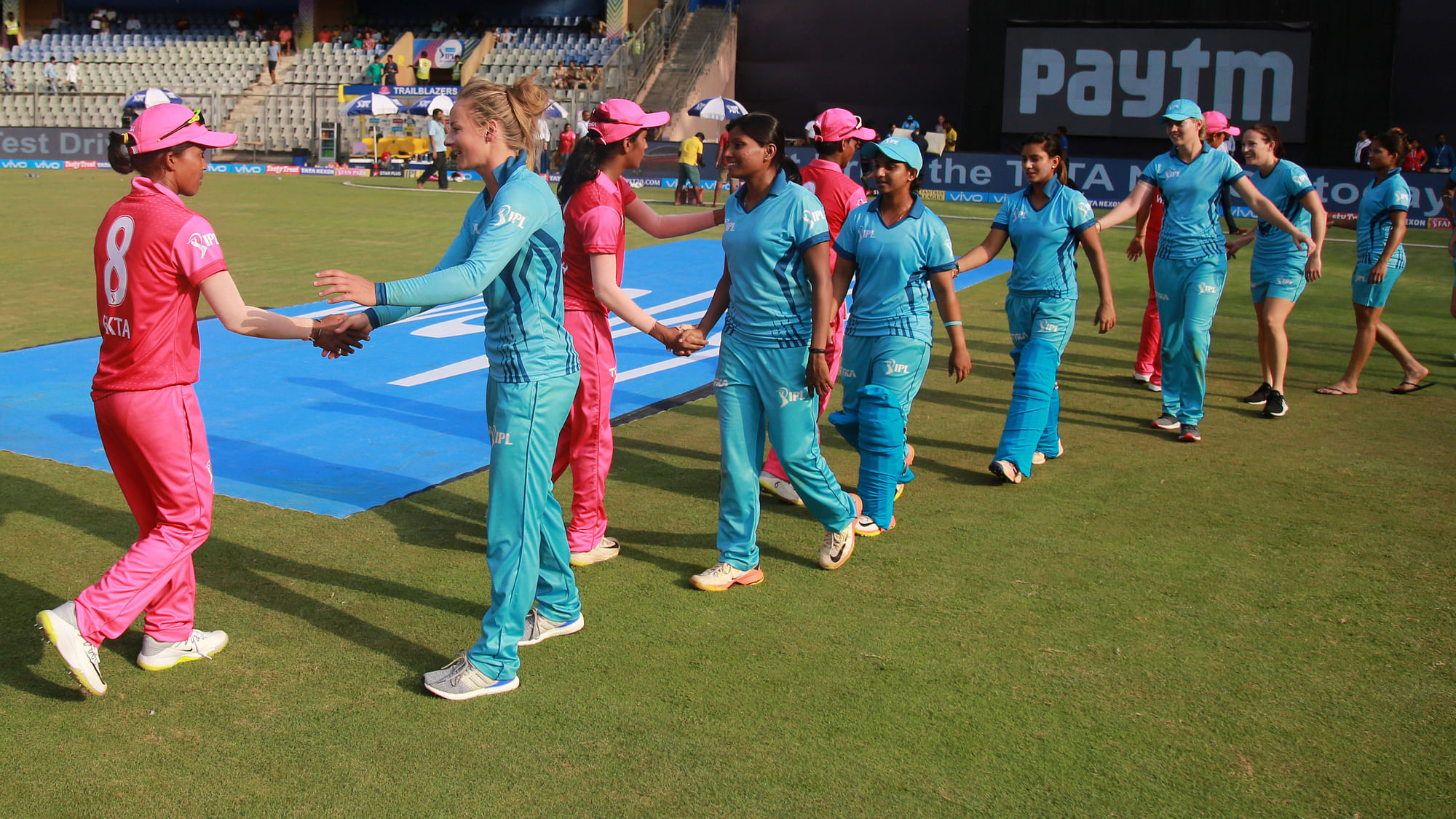 The Supernovas and Trailblazers players shake hands after the exhibition match in Mumbai on Tuesday.