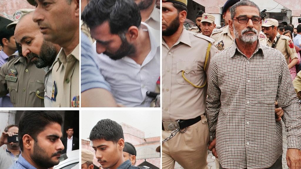 Prime accused Sanji Ram (R) and other accused of Kathua rape and murder case, being produced in District Court in Kathua, about 85km from Jammu on 16 April.