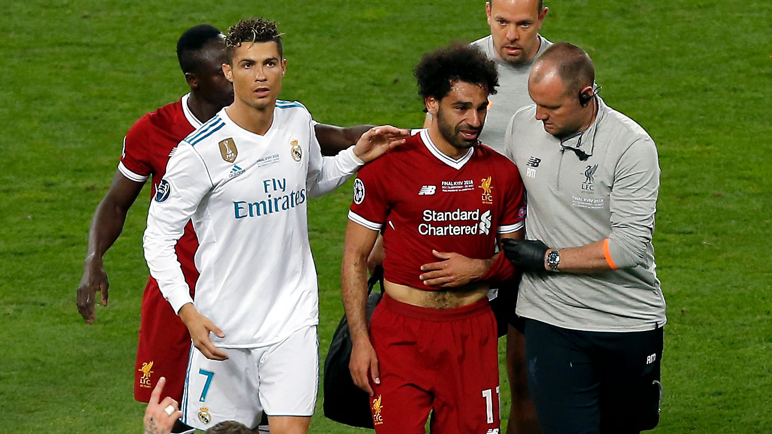 Real Madrid’s Cristiano Ronaldo, left, walks next to Liverpool’s Mohamed Salah, 2nd right, as Salah leaves the pitch during the Champions League Final soccer match between Real Madrid and Liverpool at the Olimpiyskiy Stadium in Kiev, Ukraine, Saturday, May 26, 2018.&nbsp;