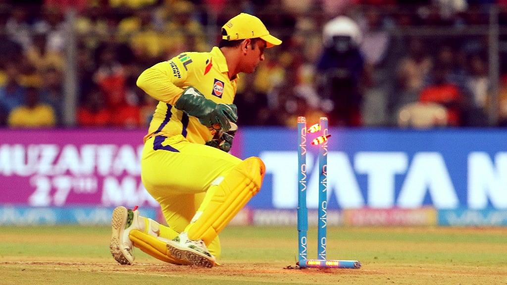 MS Dhoni completes a stumping.