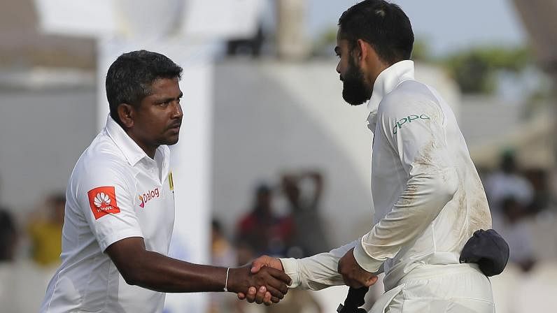 India’s captain Virat Kohli, right, shakes hands with Sri Lankan captain Rangana Herath after their win in the first test cricket match in Galle.