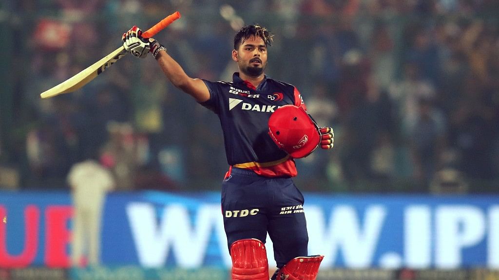 Rishabh Pant raises his bat after scoring a century against Sunrisers Hyderabad.